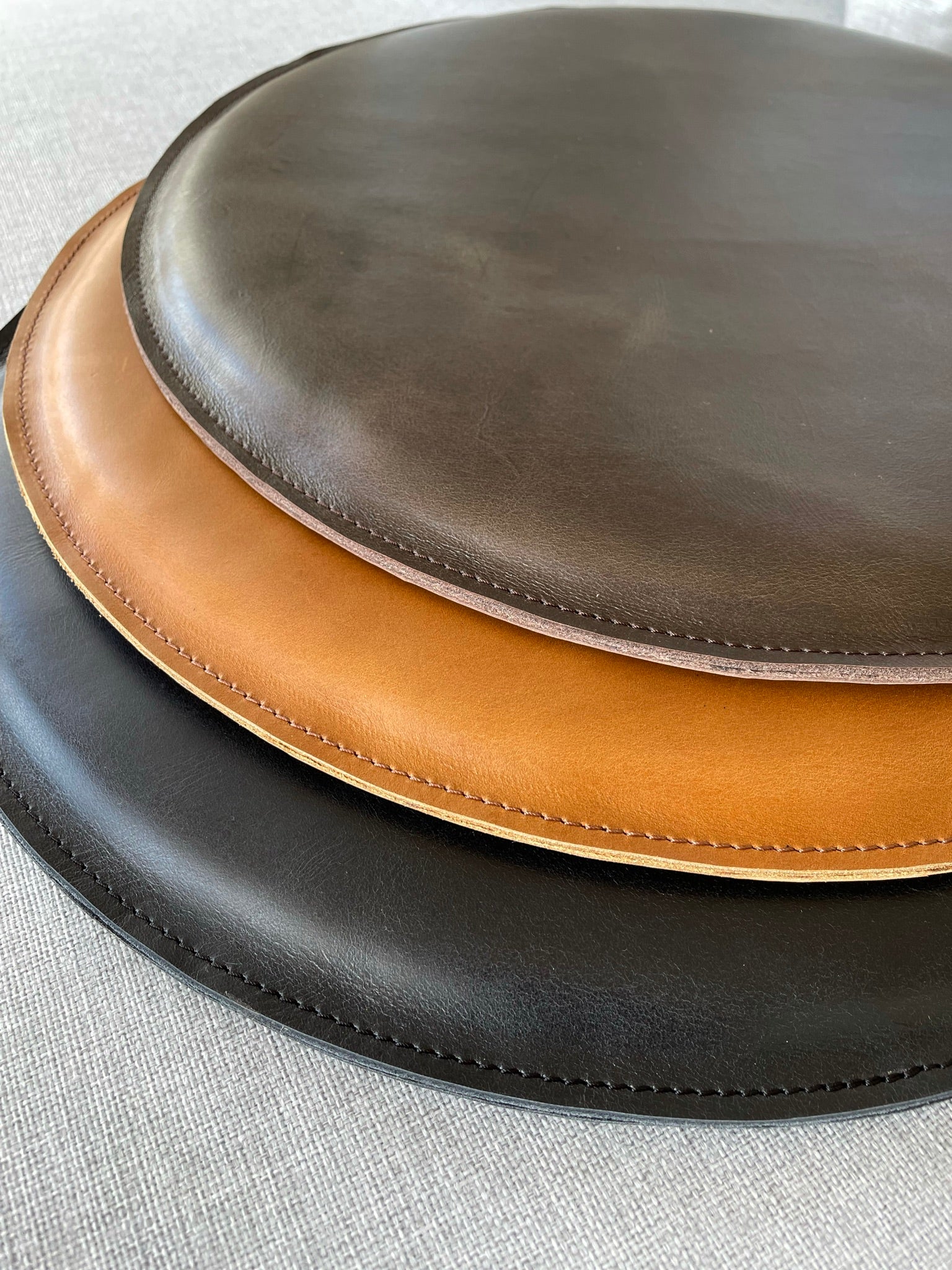 Brown, tan and black. Leather Round Cushion Tan by Modoun Home Decor
